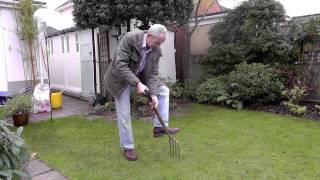 Amateur Gardening video: Tim spiking lawn