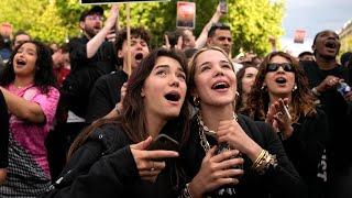 Paris crowd cheers as French election results announced