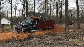 Pulling Out A Stuck Dump Truck! Kubota Excavator Trackhoe Mud Buried