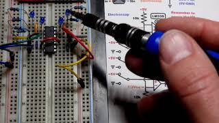 LM339 Quad Comparator IC with open collector outputs basic demo circuit schematic by Electronzap