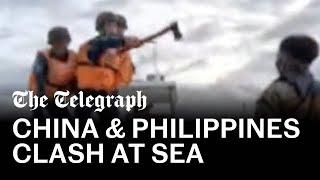 Chinese coastguard wield axes in clash with Filipino soldiers in South China Sea