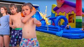 Giant Water Slide and Bounce House Summer Swim! Twins and Toys Pool Party