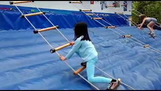 Girl Wins Ladder Climb Carnival Game