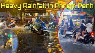 03 July 2024 Heavy Rainfall Flooding In Phnom Penh City, Cambodia, Walking In Rain With Umbrella