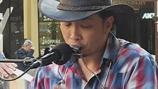 Busking Japanese Man playing blues in the heart of Melbourne