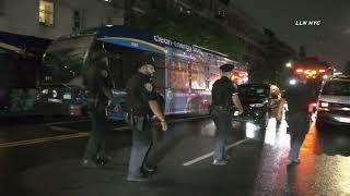 Two People & MTA Bus Shot in Harlem NYC 6.27.24