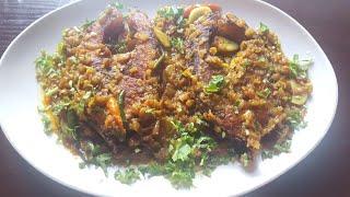 Mouth watering Rohu fish buna with garlic slice