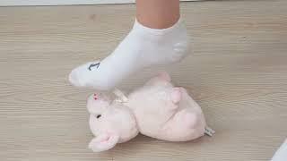 Crushing soft toy teddybear pig with sport shoes and socks