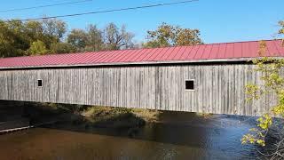 Flying under a covered wood bridge in Hamden, New York