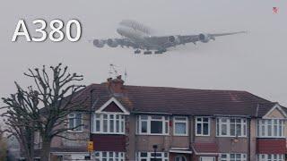 Airbus A380 Emerge from thick fog above the houses