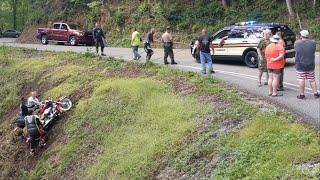 Tail of the Dragon- police and Tennessee Highway Patrol pull motorcycle out of gulch.