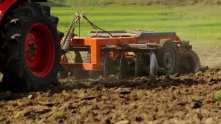 Kubota L5018 4WD Tractor coupled with 8x8 Trailing Harrow