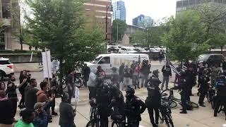 Police appear to use powder spray on protesters outside Schurr murder trial
