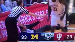 Michigan's Mo Wagner runs over Indiana coach Tom Crean after 3