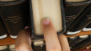 Man Picking Book in Library 03 / Free Stock Footage (4K)