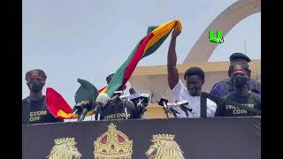 FREEDOM JACOB CAESAR mounts a podium at the Black Star Square to mark Ghana’s 65th anniversary.