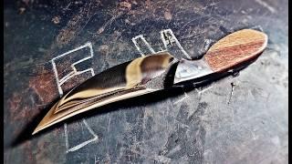 The old rotary blade from the tiller is made into a camping knife