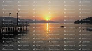 Timelapse scenic sunrise on mountain and sea landscape. Morning sun rising over mountain silhouette