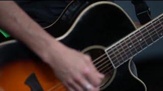 Local musician Chris Reed performs original song