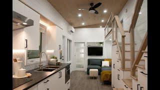 Luxurious tiny home for a family of 4 features tons of storage!