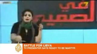 Libyan presenter waves gun and vows to defend station