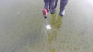 checking ice thickness on lake Wabamun