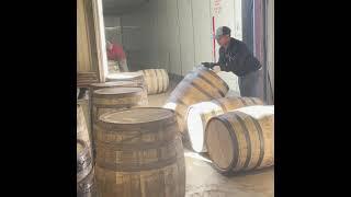 Behind The Barrel (Unloading A Truck Full of Barrels) by Midwest Barrel Company