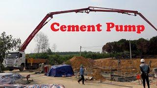 Pouring cement, concrete for building foundation [The US Fly]