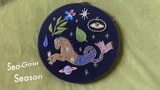 embroidering and beading a Capricorn Hoop