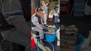 Tsukiji -a bustling fish market in Tokyo #japan #tokyo #fishmarket #tsukiji #travelvlog #streetfood