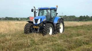 Newholland T 7060 mowing grass 2