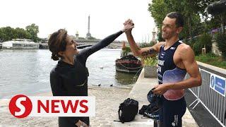 French sports minister swims in Seine ahead of Olympics