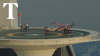 Red Bull stunt pilot lands plane on 700ft-high Burj Al Arab helipad