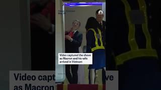 French President Emmanuel Macron's office is downplaying the moment his face was shoved