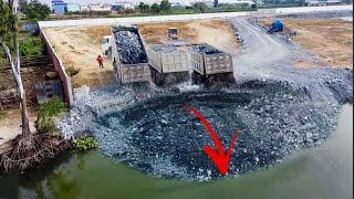 Unbelievable!! Big Land Slide Into Water And Dump Trucks Try To Loading So Many Stones Into Water