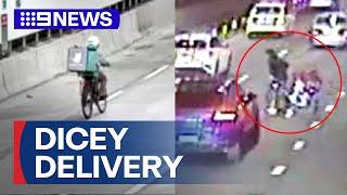 Food delivery cyclists risking their lives in tunnels | 9 News Australia