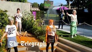 Woman hoses down Just Stop Oil protesters at Chelsea Flower Show