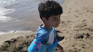 Kids are so happy to play with mod, to play with sand in Manhattan Beach. Fun day, happy kids.