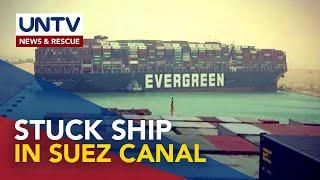 Massive container ship stuck sideways in Suez Canal