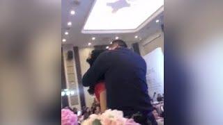 Father plants kiss on son's bride in front of wedding guests