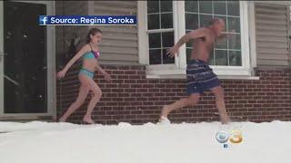 11-Year-Old Girl, Dad Enjoy Snow Day In Bathing Suits