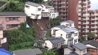 House crashes down hill after Japanese mudslide