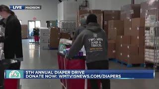 Donations being unloaded from WMTV 15 Diaper Drive