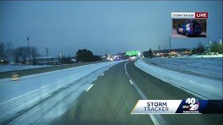 Roads covered in snow, although interstates have passable lanes