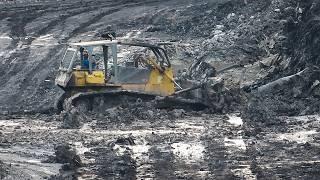 Bulldozers pushing mud on Coal Mine Road