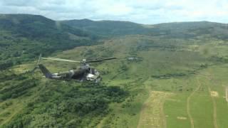 Mi-24 Hind helicopters shoot rockets from pilot view perspective