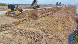 Great Action!! Shantui Bulldozer Working Hard Pushing Many Soil On The Land Into Water