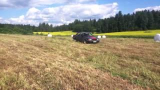 Backwards donuts in a 1989 Nissan Sunny in a field