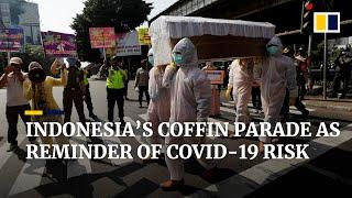 Indonesia parades ‘coffin’ through busy traffic to emphasise dangers of Covid-19