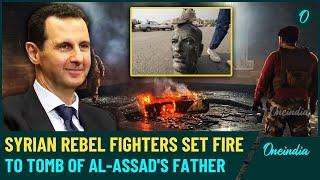 Syria BREAKING| Assad’s Father’s Tomb Reduced to Ashes as Angry Rebels Stand Over Charred Remains